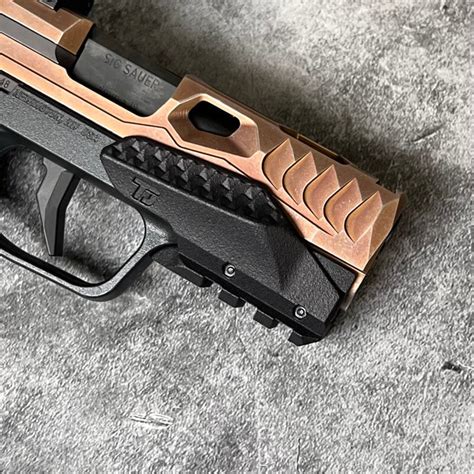 Completely re-designed grip geometry with the acclaimed back strap swell. . Tactical development p365 x macro